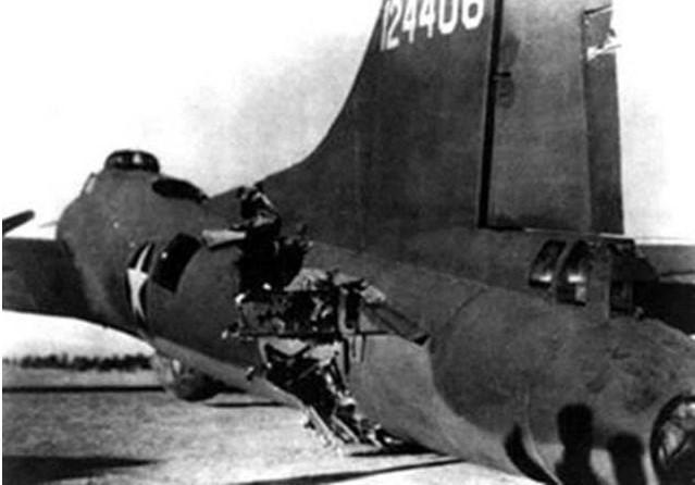 An enemy fighter attacking a 97th Bomb Group formation went out of control, probably with a wounded pilot, then continued its crashing descent into the rear of the fuselage of a Flying Fortress named