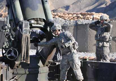 firing lanyard seconds before he discharges a 155mm round from a M777 Howitzer from Combat Outpost Garcia in eastern Afghanistan s Nangarhar Province, Oct. 2. U.