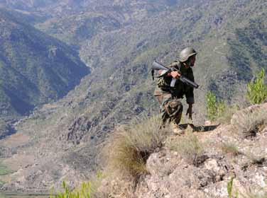 An Afghan National Army Soldier climbs a mountain in eastern Afghanistan s Kunar Province Sept. 21.