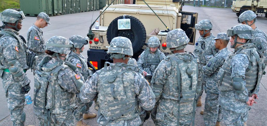 Soldiers from the 16th Sustainment Brigade s 106th Financial Management Support Unit huddle for a tactical convoy briefing during a training exercise involving Soldiers from four geographical