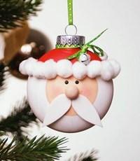 Santa Claus is comin to your tree with this adorable ornament!