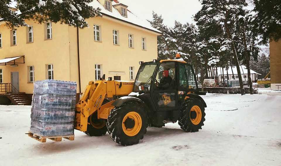 A contract worker drives a forklift to deliver water to Soldiers at Zagan, Poland, on Jan. 18, 2017. (Photo by 1st Lt.