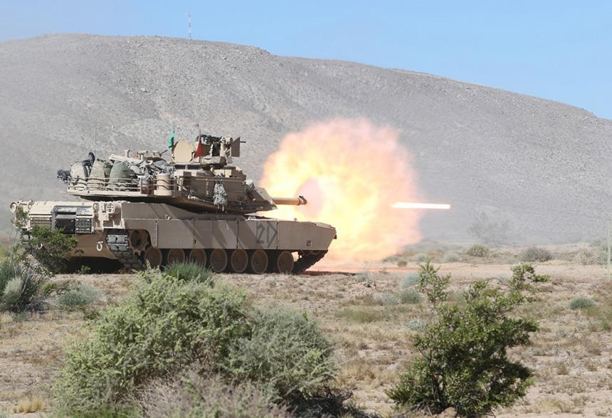 Figure 1. An Abrams tank with 2 nd Battalion, 198 th Armored Regiment, fires a 120mm projectile during battalion hasty-defense live-fire training at the National Training Center, Fort Irwin, CA.