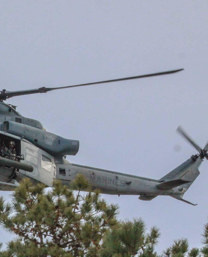 5 A soldier from the New Jersey Army National Guard s 1-114th Infantry secures a rally point as Marine Aircraft Group 49 UH-1Y
