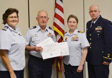 The 2017 DCDR Amy Thomas (l) with CDR Kate Higgins-Bloom Response Chief SHR, 2017 VCDR Eric Perkins, and BOSN2 Jack Williams OTO 5 SR Amy Thomas of Flotilla 33 was sworn in for her