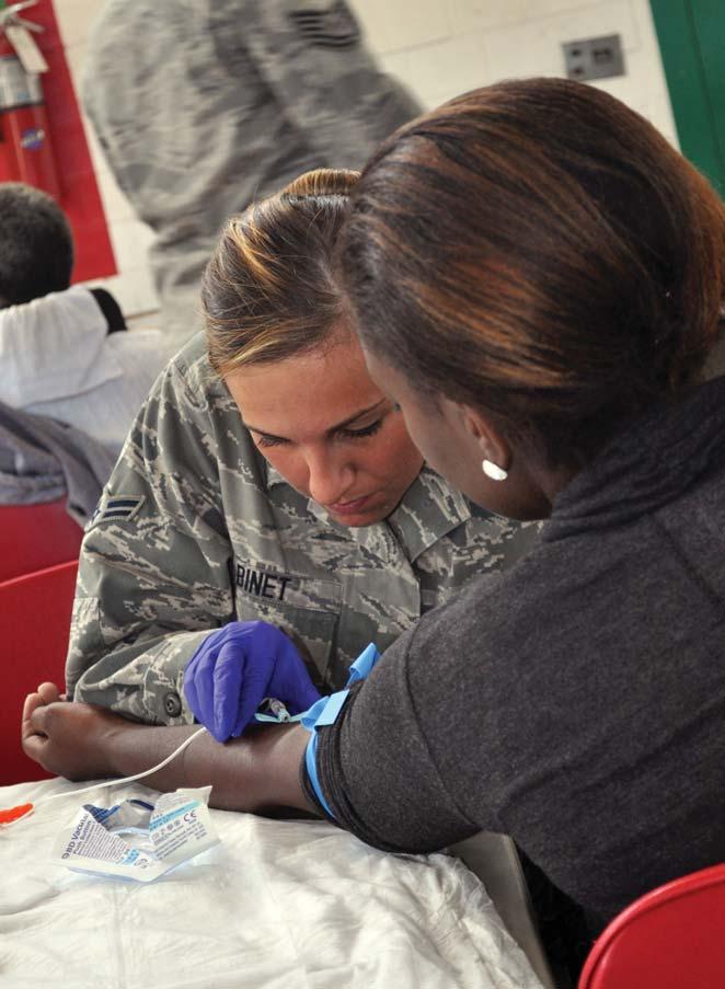 counseling, a hot meal, a haircut and winter clothing. Airman 1st Class Taylor Binet, 177th Medical Group, New Jersey Air National Guard, aids a homeless veteran seeking medical access.