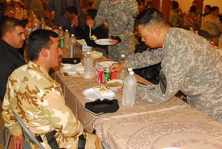 partners and was glad he had the opportunity to share in a traditional American holiday with them also. I have fed the U.S. Soldiers many times, and it is good to have them feed me for once, he joked.