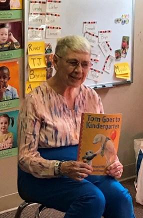 Not only did she read the story using an expressive voice but she turned the book to show the pictures and started asking the children questions to engage them.