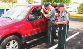 Pictured Above: Indian River County Sheriff's Volunteers unlocking a car for a citizen.