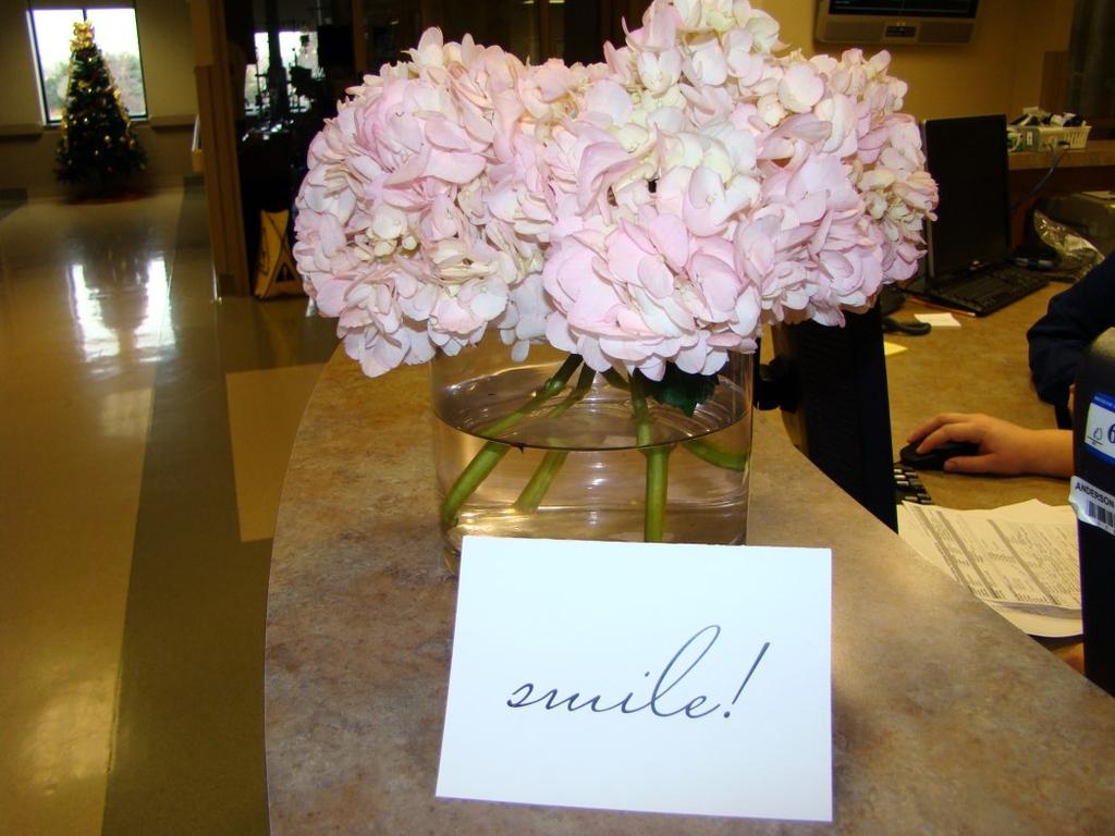 in the past. Staff were delighted to see small bouquets of pink roses and hydrangeas throughout the hospital with a sweet card telling all to simply "Smile.
