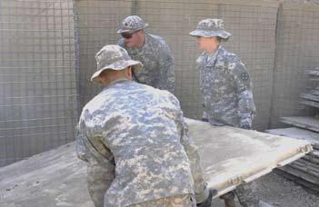 29. Hill and other 1192nd Soldiers are building a more secure ASP for the 30th Heavy Brigade Combat Team to improve safety standards. From left to right, Staff Sgt.