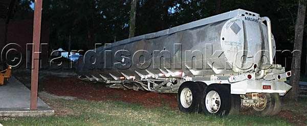 This tanker trailer has holes in it, perhaps to allow flames to shoot out as firefighters train.