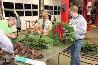 Lions Club Wreaths. It is time to get your fresh wreath! About a dozen Boy Scouts joined with members of Tremont Lions Club to make Christmas wreaths.