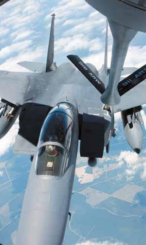 The Strike Eagles are distinguished from their F-5 brethren by conformal fuel tanks and the dark gray paint scheme of a strike