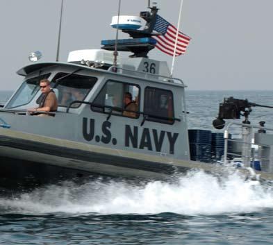 their boat on the Persian Gulf; Sailors conduct a security