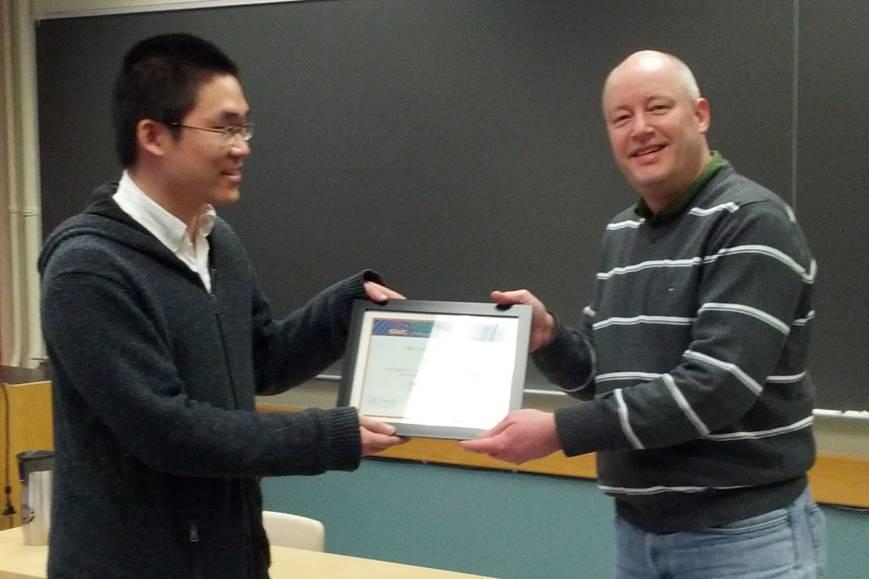 SIAM Chapter member at the University of Michigan, Feng Wei (left) receiving