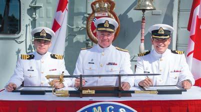 12 LOOKOU August 28, 2017 HMCS Ottw Chnge of Commnd Reviewing Officer, Commodore Jeff Zwick (centre), signs