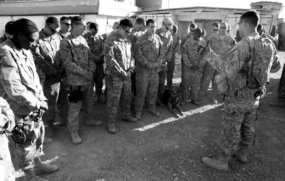 (U.S. Army, CPL Robert Thaler) U.S. Army Chaplain CPT Robert Sterling, gives blessings at Police Sub Station 3, Kandahar City, Afghanistan, 25 November 2010.