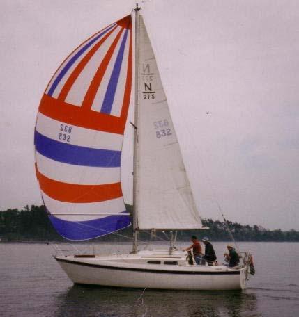 NAUTICAL CLASSIFIEDS SAIL FOR SALE 12 foot spinnaker pole and a red, white and blue radial head 180% - 633 Sq. ft. McKibbin spinnaker, number 832.