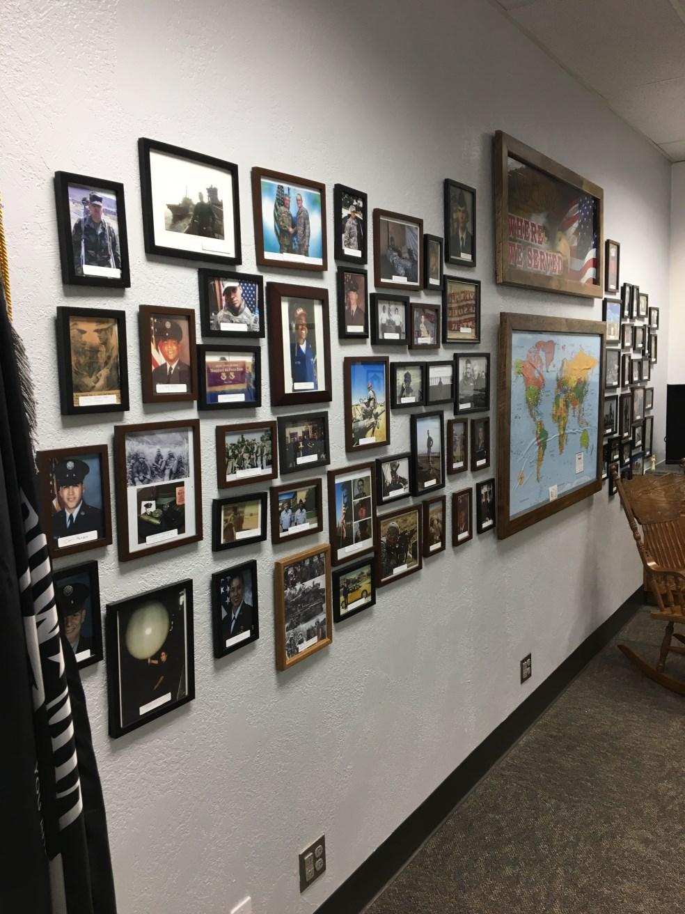 It began with just a few photos of student veterans, but now the Veterans Wall at the VRC has grown and is almost completely covered.