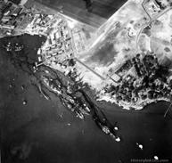 The Damage to the Pacific Fleet The USS Arizona Battleship Row during the attack (above) and days later (right) showing the massive spill of fuel oil into the