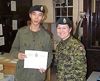 Presenting the certificate is MWO April White. The picture below shows MWO White presenting the Certificate to Private Jian Liang. He was also successful in completed the course.