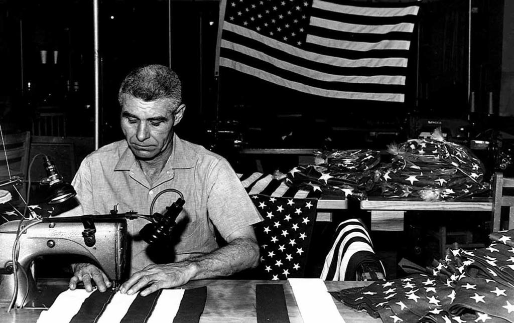 Then & Now 1977 - The Legislature establishes a seven member State Prison Industries Advisory Board An offender tailor is shown felling stripes on the new 50-star United States Flag in 1960.