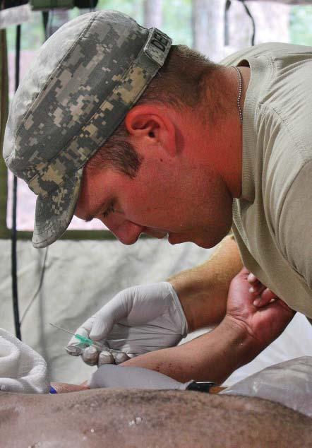 The medic s command structure provided three echelons of health care in the training areas and a Brigade Medical Support Company aid station in the garrison section of the installation.