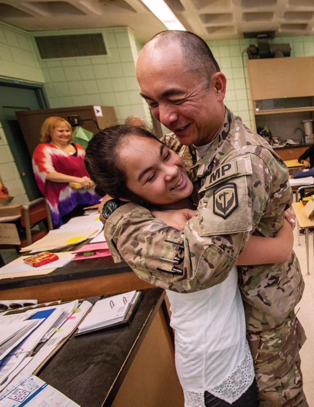 30 1st Sgt. Joseph P.C. Prieto, 508th Military Police Company, surprised his daughter Allison in her sixth grade class in Parlin, N.J., June 7, 2013.