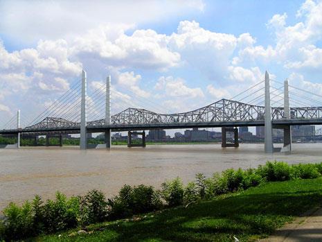 approached their bridge projects differently: Kentucky: design-build using GARVEEs, TIFIA, and tolls