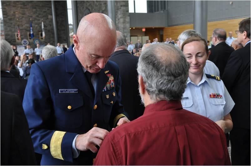 A lapel-pinning ceremony was held at U.S. Coast Guard Headquarters to recognize Vietnam-era veterans who served between 1955 and 1975.