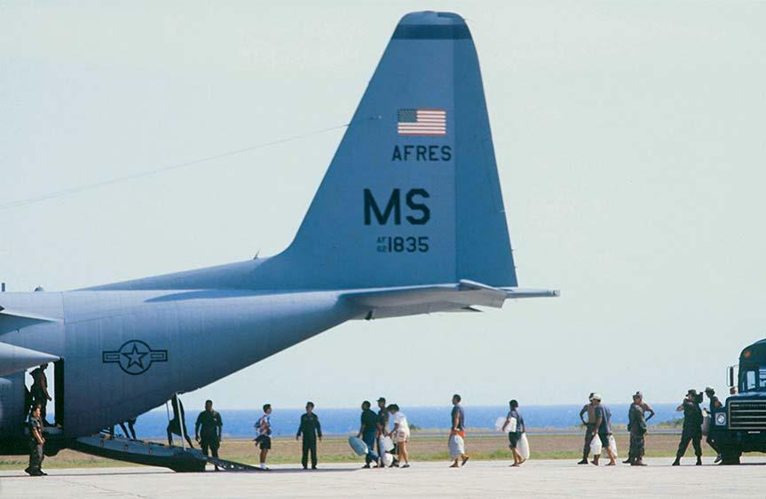 Crisis Response and Limited Contingency Operations Selected Haitian noncombatants board a US C-130 bound for safe haven camps in Panama during Operation ABLE MANNER.