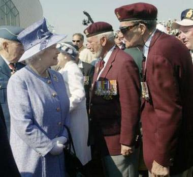 Queen Elizabeth talks with Canadian veterans during ceremonies marking the 60th