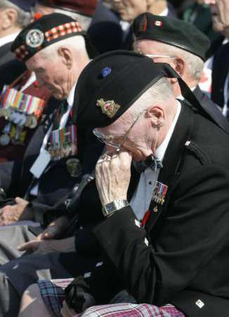 Canadian veterans spend a few quiet moments to themselves during