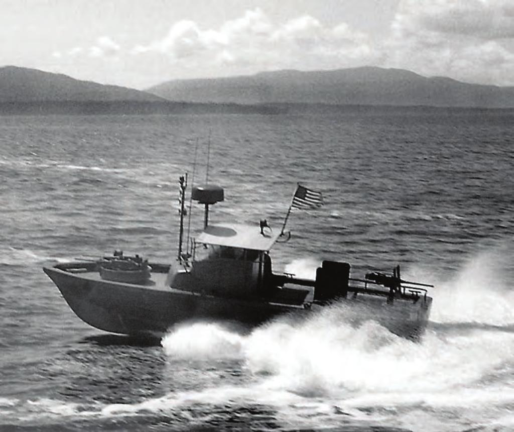 A United Boat Builders 31-foot Navy PBR (Patrol Boat River) completes a 180 degree, hairpin turn on Bellingham Bay during sea trials in 1966.