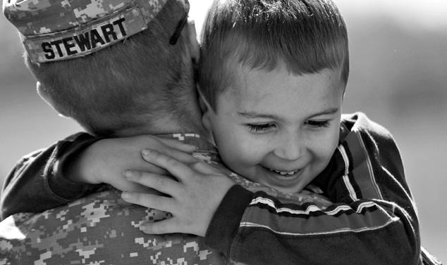 U.S. Army photo, John Crosby A soldier says his goodbyes during a departure ceremony at Camp Atterbury Joint Maneuver Training Center, Indiana, 25 September 2010.