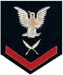 Petty Officer Third Class: The rating badge on the right sleeve of the overshirt and jumper. One stripe on the chevron.