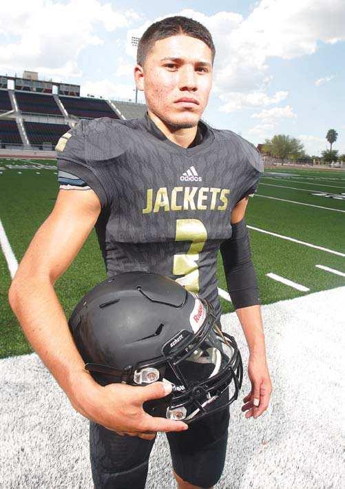 SECONDARY SEE TREVIÑO ON PAGE 51 Edcouch-Elsa s Albert Treviño holds his helmet Aug.