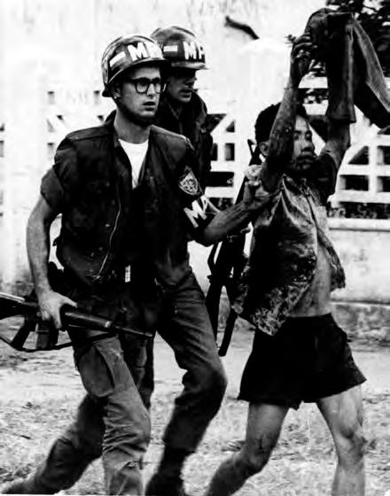 Military Police escort a captured Viet Cong from the