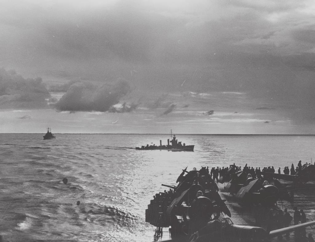 fdr4freedoms 3 A watchful U.S. destroyer cuts through the wake of a U.S. aircraft carrier on patrol after a day of fighting off North Africa, 1942 or 1943.
