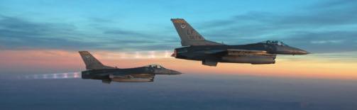 A pair of F-16s show the tail markings for the 56th Fighter Wing, Luke AFB, Ariz.