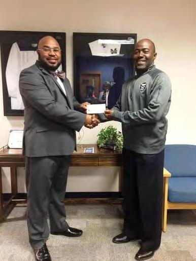 OML has partnered with Marietta City Schools to form a mentoring program for male students and on March 16th Brother Arthur Vaughn presented a gift to Dr.