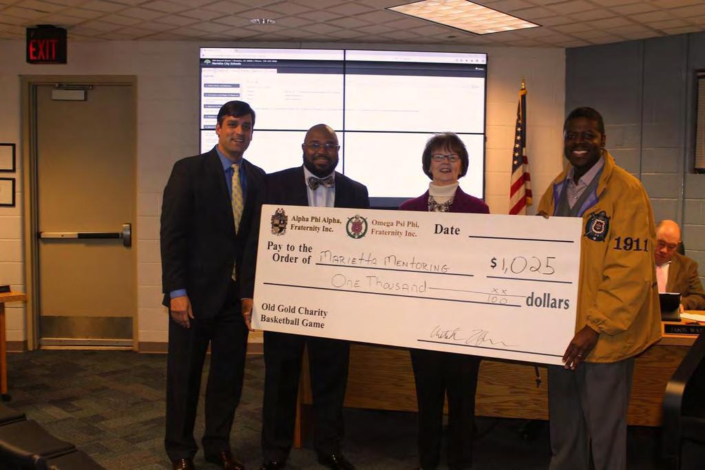 presented proceeds from our 4th Annual Old Gold Charity Basketball Game to the Marietta