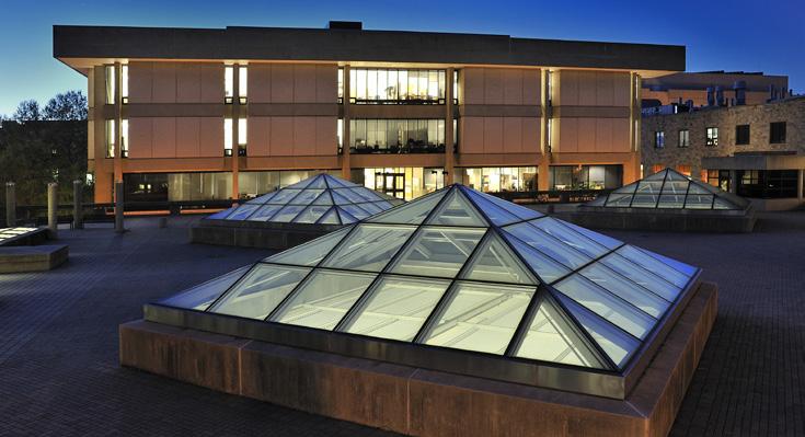 The pyramids on the plaza allow natural light into the studio spaces.