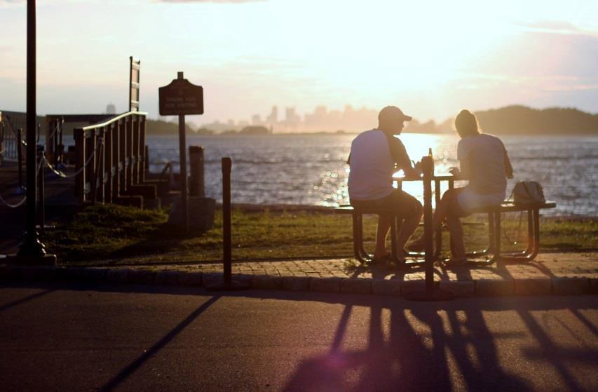 Georges Island visitors enjoy a late afternoon snack while looking back towards the Boston skyline The special events business is expected to include both events open to the public, such as the very