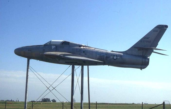 RF-84F-46-RE 53-7560 "on sticks" at the airport in David City, Nebraska. It appears that the aircraft was previously painted in SEA camoflauge, but it has been stripped to NMF.