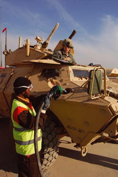 as a Sri Lankan contractor fuels his Armored Security Vehicle at the retail fuel farm at Contingency Operating Base Q-West, Iraq, Jan. 18. U.S. Army photo by Spc. Brian A.