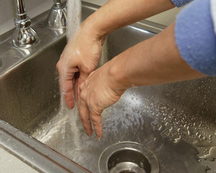 Rinsing Hands Under Running Water