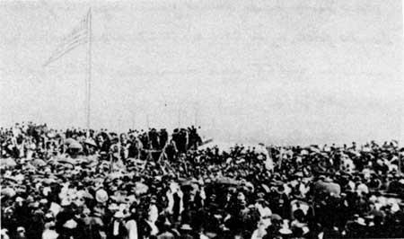 This is the only known close, up photographic view of the rostrum (upper left) at the dedication of the National Cemetery. The view shows a part of the audience which was estimated at 15,000.