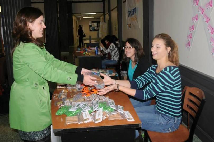 Christina Garman Miller buys snacks from students who are